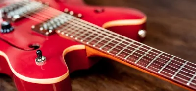 Close-up of a hollow-body jazz guitar being played
