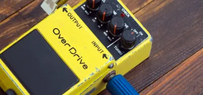 Overdrive pedal connected to a guitar amplifier signal chain
