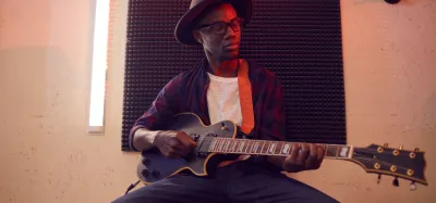 Guitarist playing a blues riff on an electric guitar