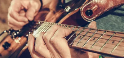 Beginner playing surf guitar songs on an electric guitar
