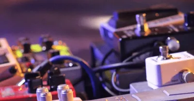Overdrive and distortion guitar pedals on a pedalboard