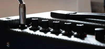 A vacuum tube guitar amp beside a solid-state amp for comparison