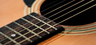Closeup of guitar strings showing the standard tuning order E A D G B E