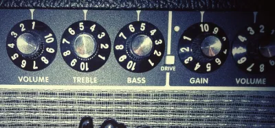 Guitar amp control panel showing gain and master volume knobs