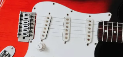 Close-up of an electric guitar pickup that has gone microphonic and squeals through an amp